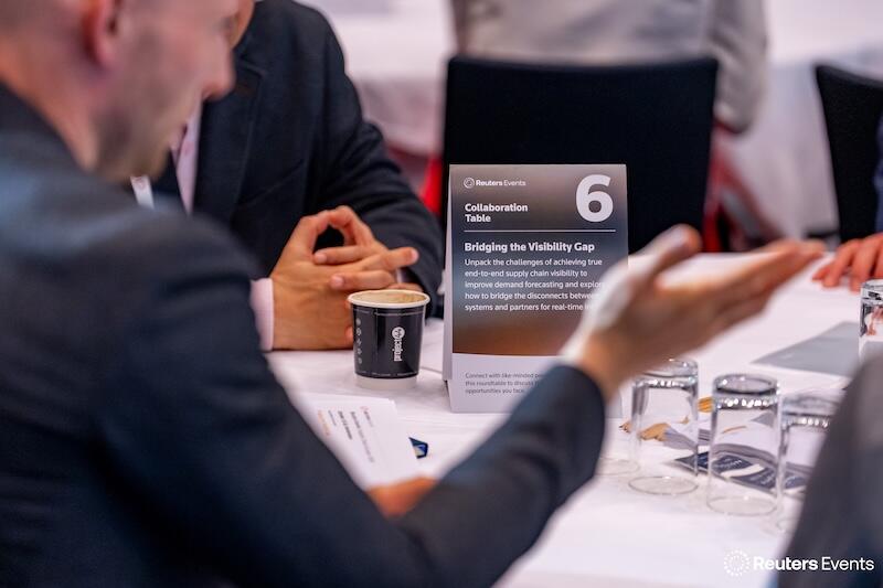 A photo of people at a table at Supply Chain Europe 2025