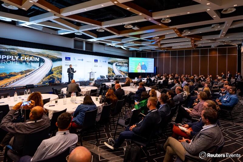 A presentation with a speaker on stage, showing a room full of people at Supply Chain Europe 2025