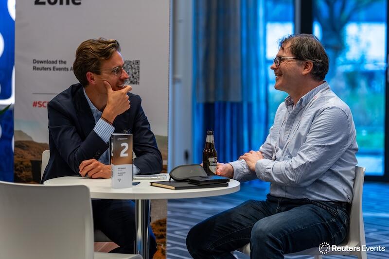 Two people networking at a break out area at Supply Chain Europe 2025