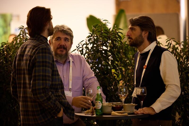 People networking with drinks at the after event.
