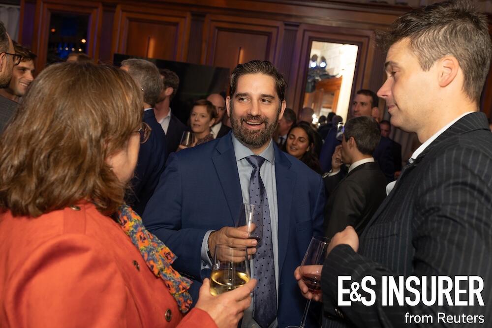Photo of a social drinks event with people talking