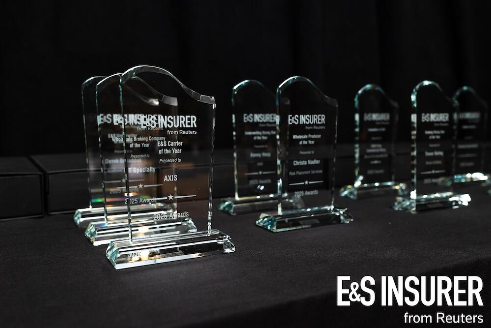 A photo of the glass awards etched with the winners name and the E&S insurer logo