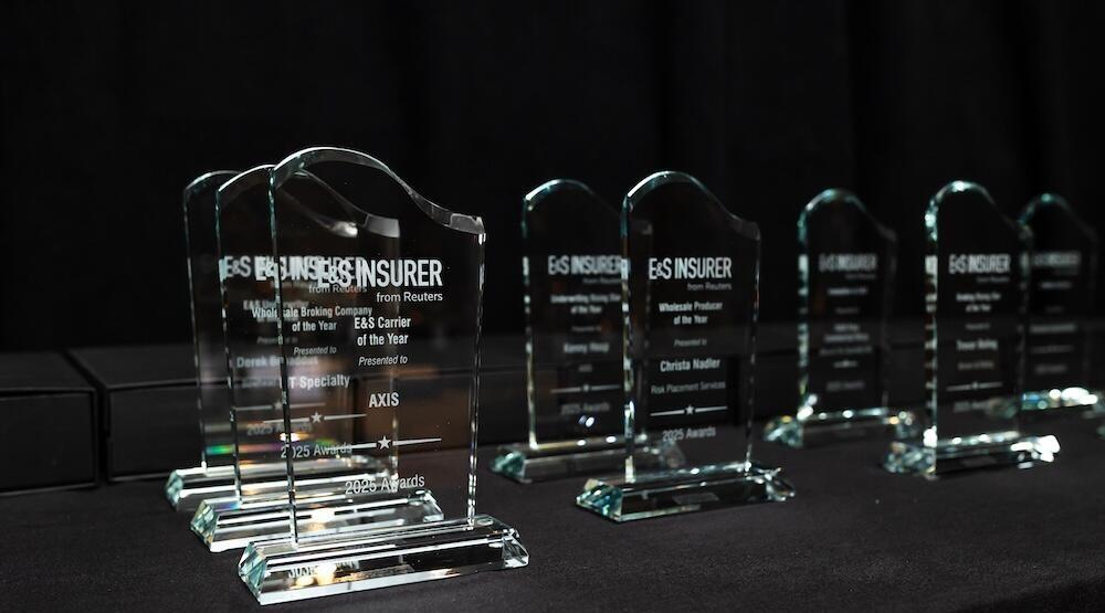 A photo of the glass awards etched with the winners name and the E&S insurer logo