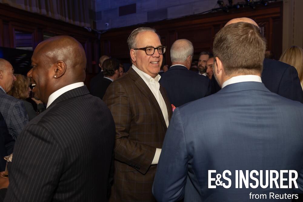 Photo of a social drinks event with people talking