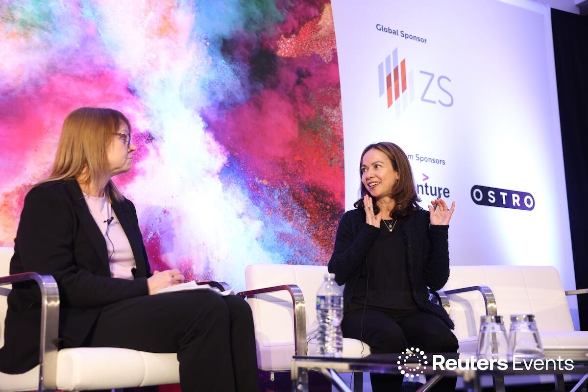 Two people on stage at one of our events.