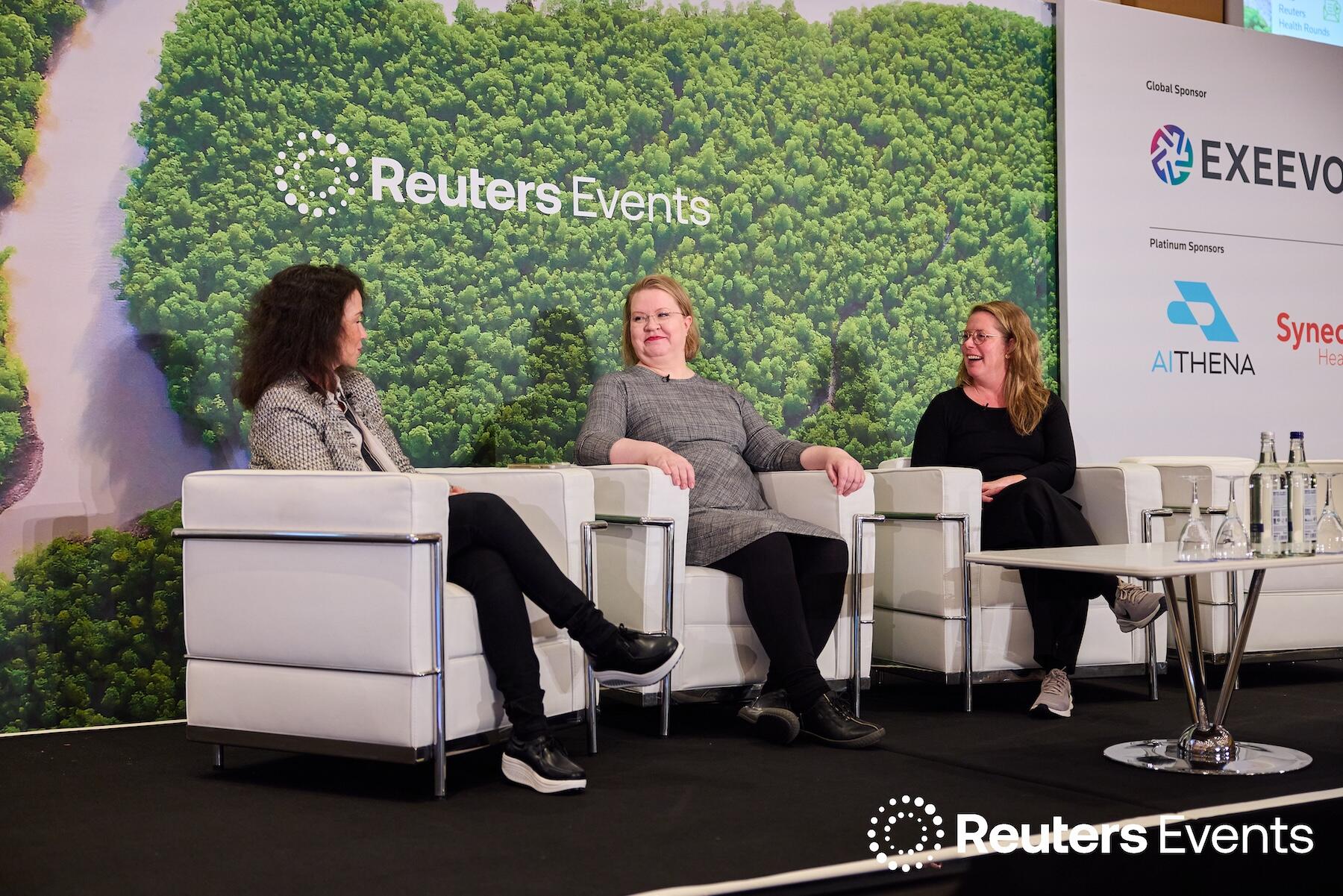 Three people on stage at one of our events.