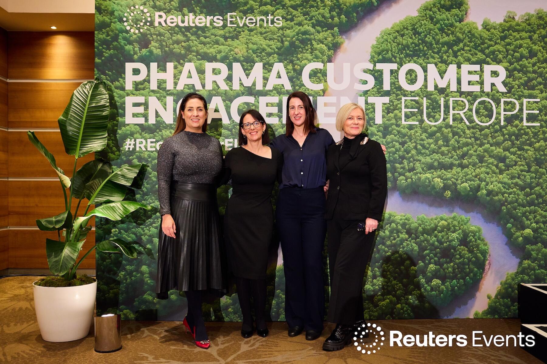 Four people on stage at one of our events.