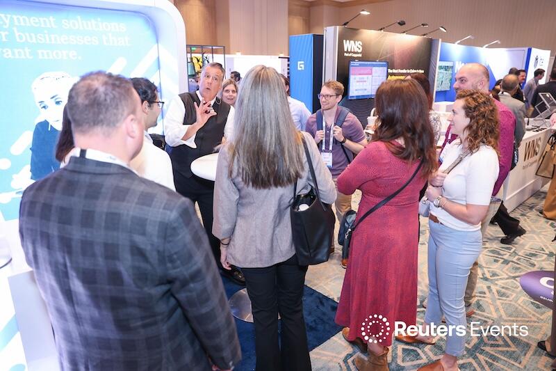 A group of people around someone giving an expo talk