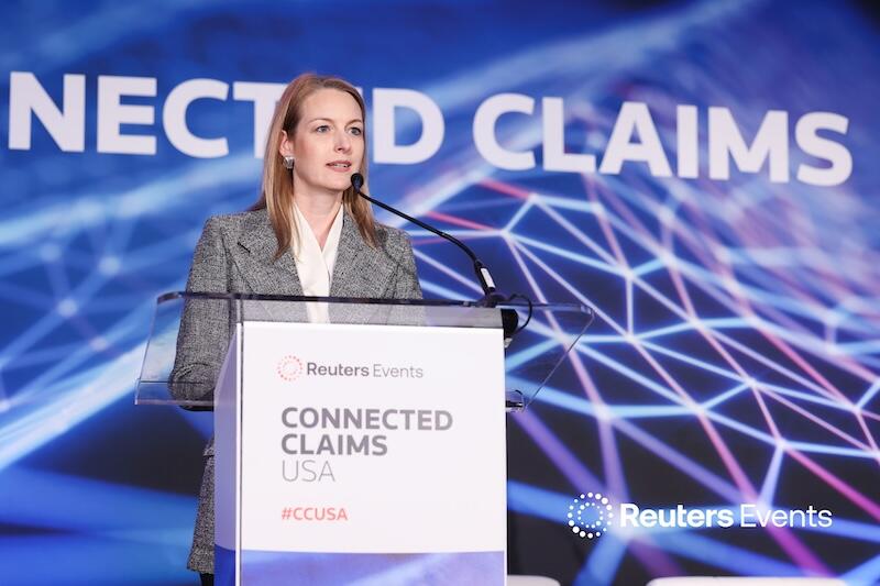A presenter on stage talking