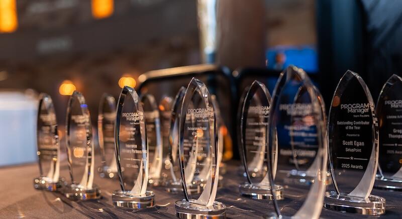 The glass awards for the 2025 show lined up on a table
