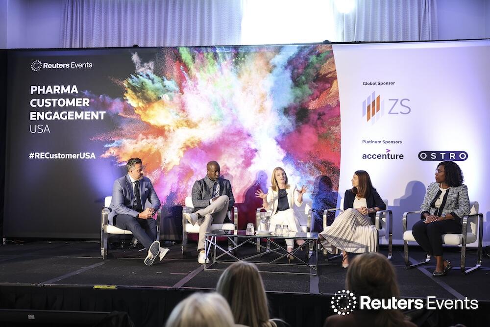 5 people on stage at our Pharma Customer Engagement USA show talking about Prioritize patient-centric value