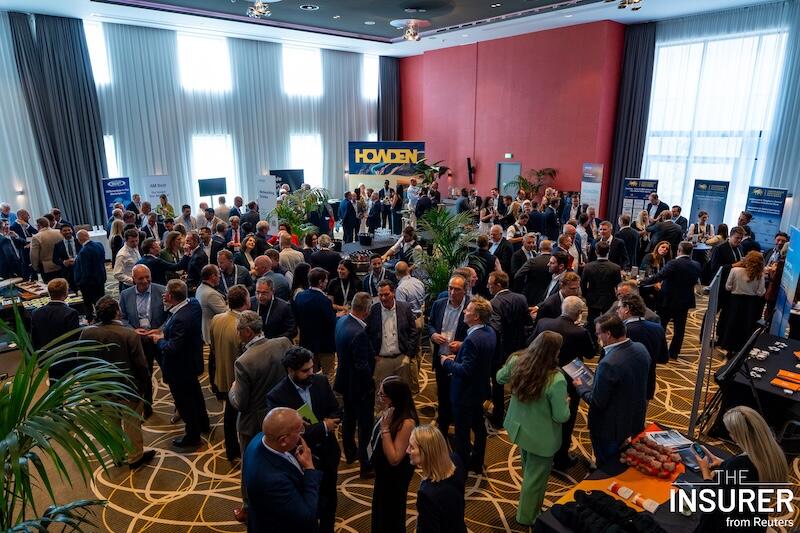 A room full of people at the MGA summit last year networking over drinks