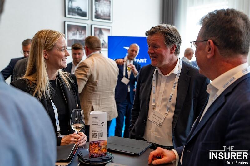 Thee delegates at the MGA summit last year networking over drinks