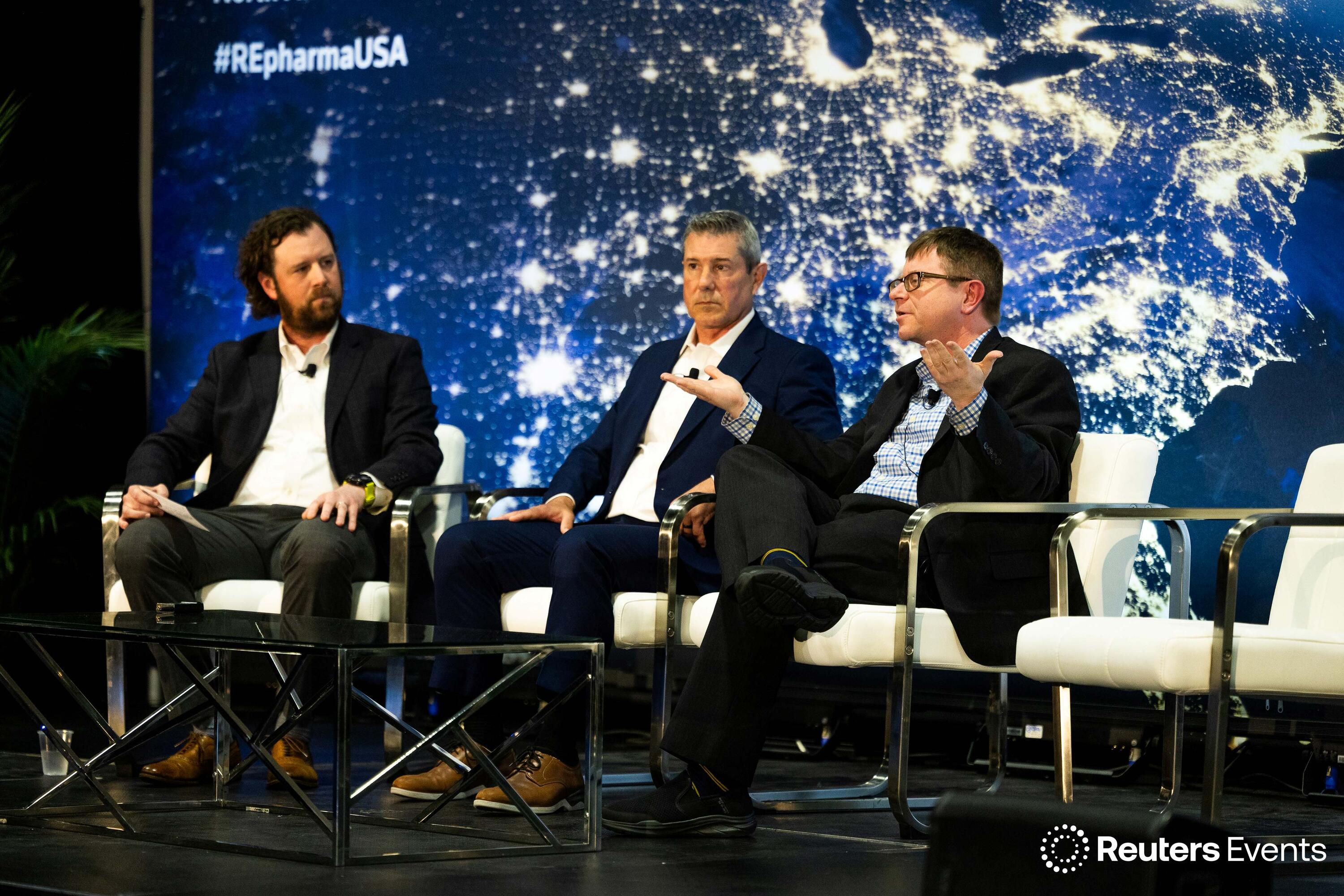 People on stage at a Reuters Events conference