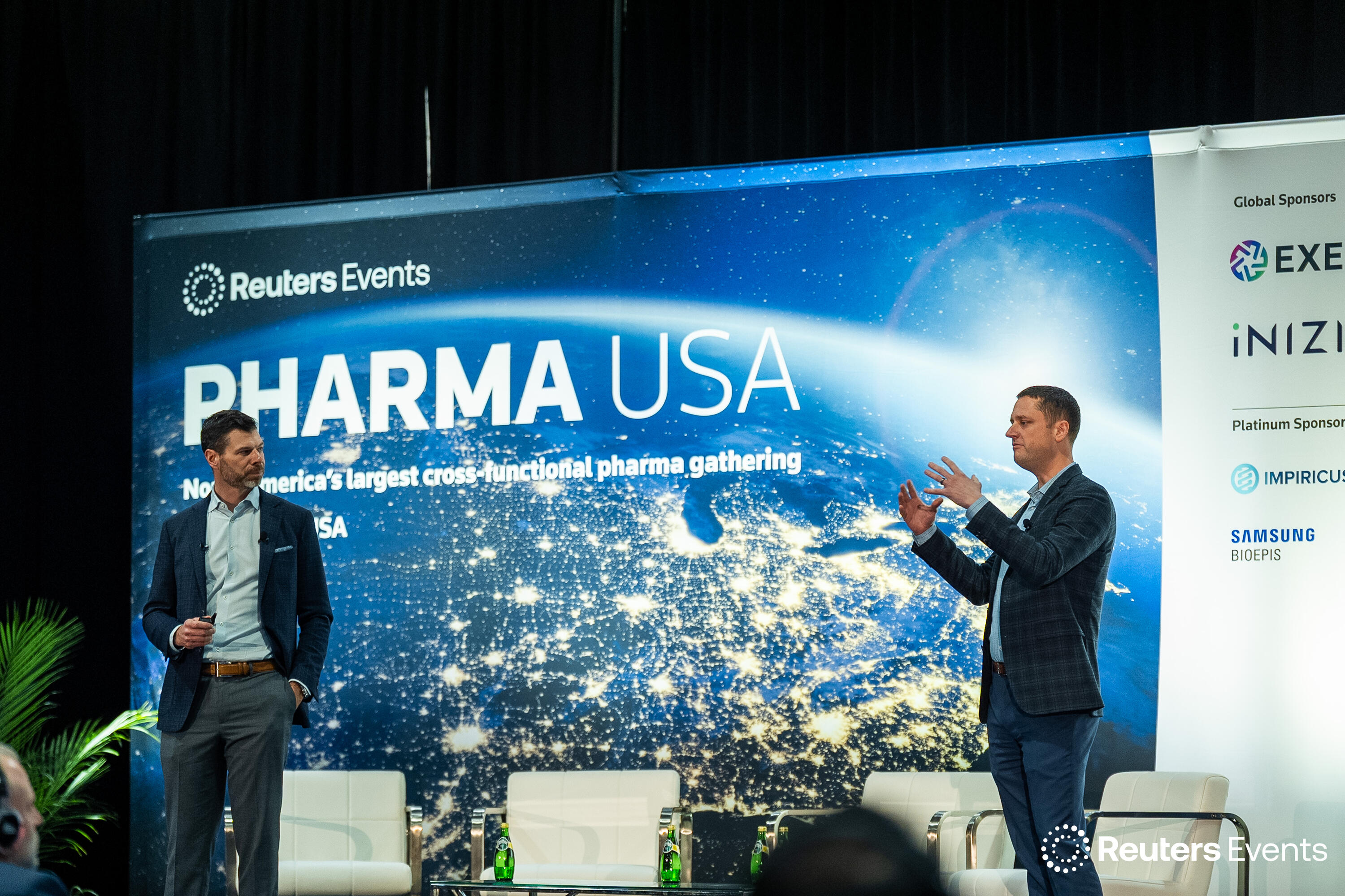 People on stage at a Reuters Events conference
