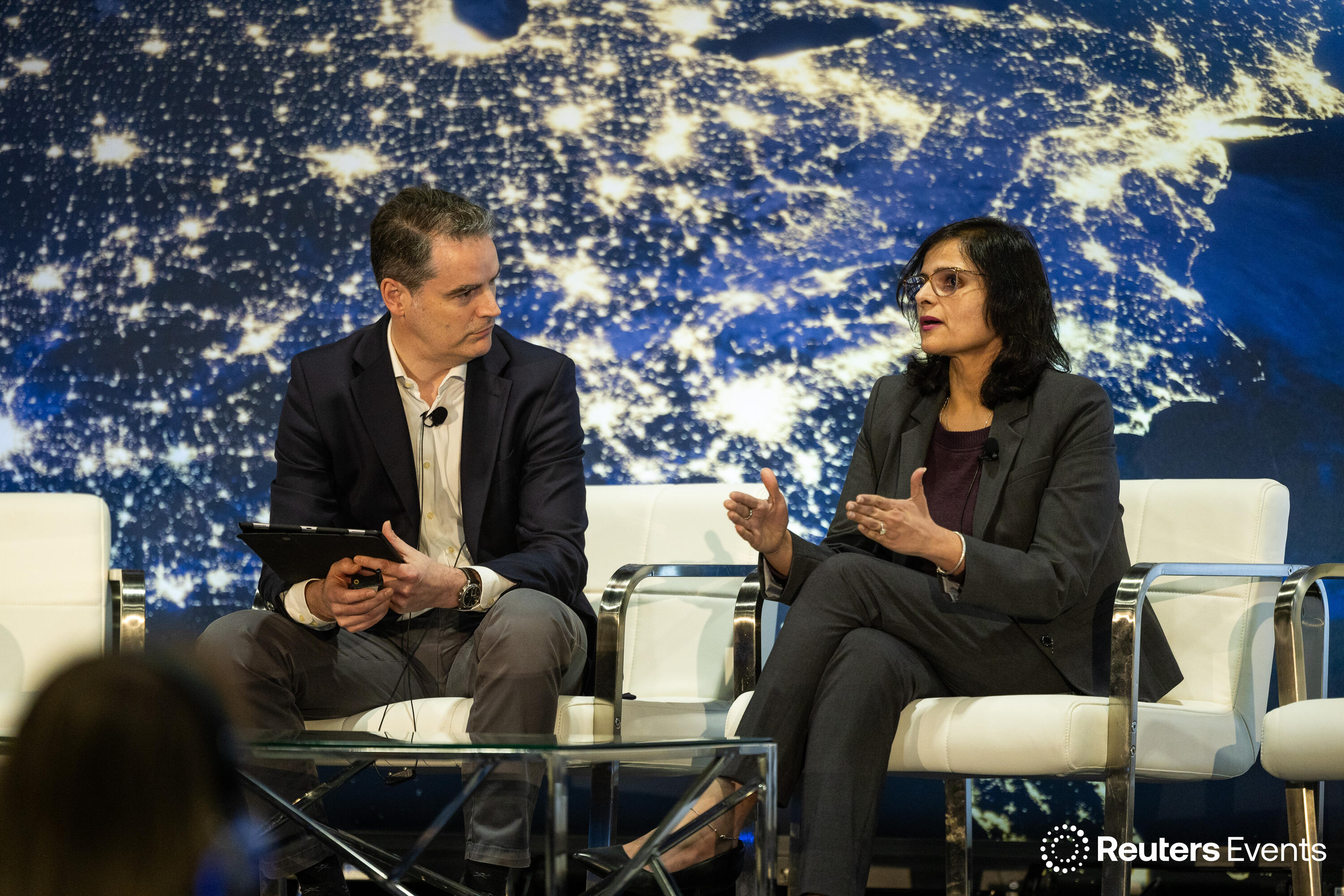 People on stage at a Reuters Events conference