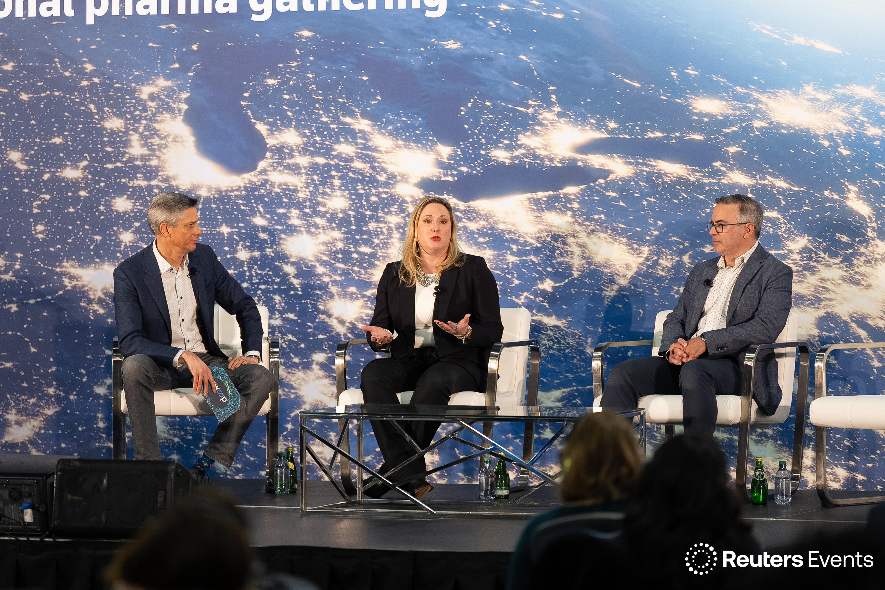 People on stage at a Reuters Events conference
