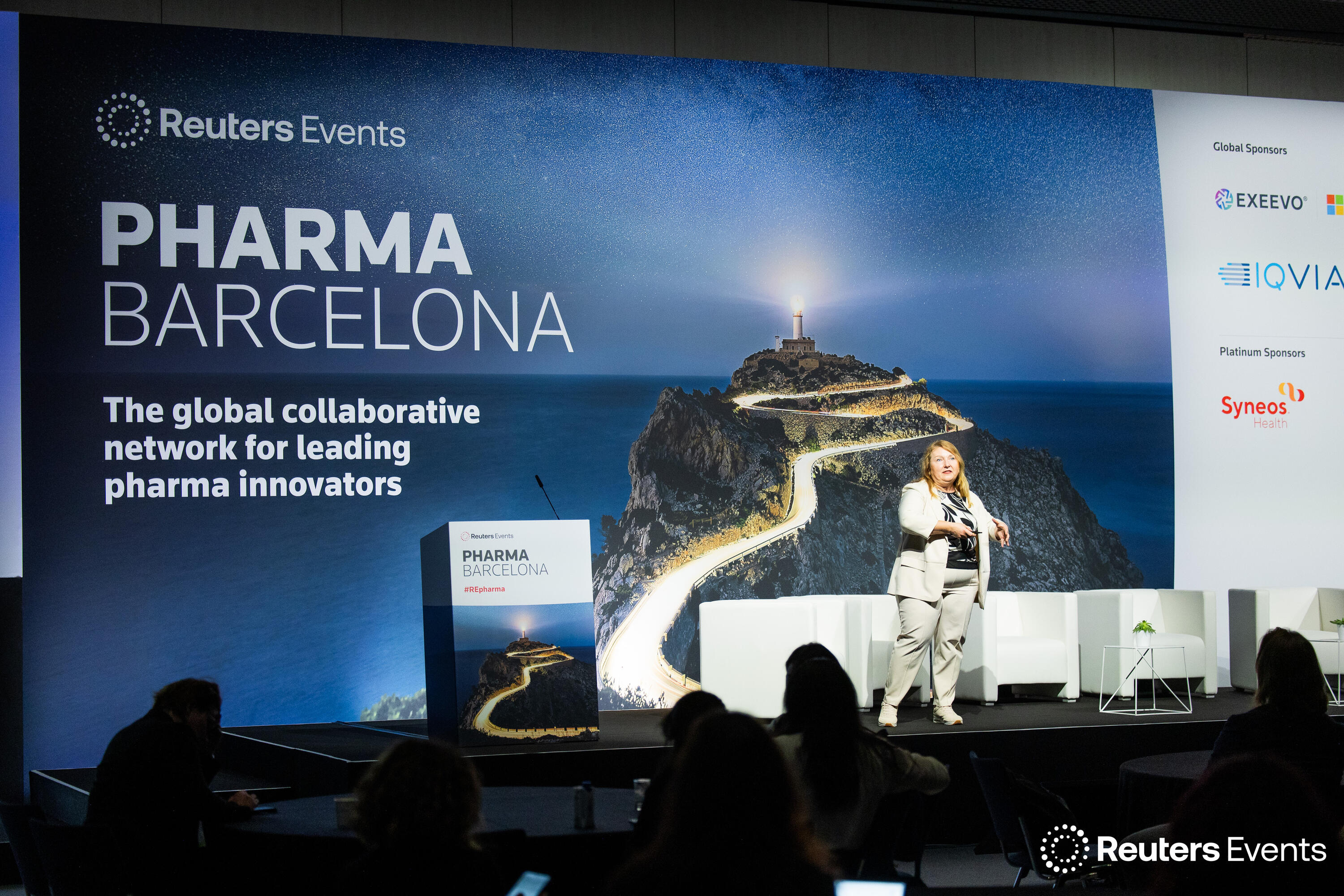A speaker on stage at Pharma Europe