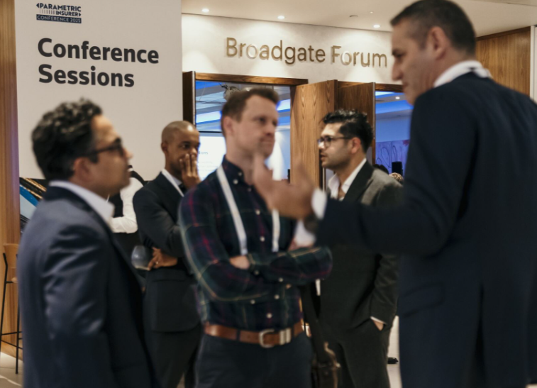 A room full of people at the MGA summit last year networking over drinks