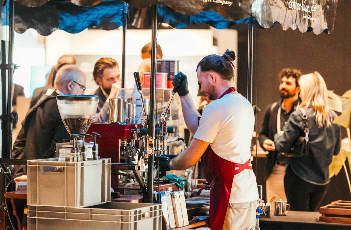 A barista pours coffee onsite at a Reuters Event
