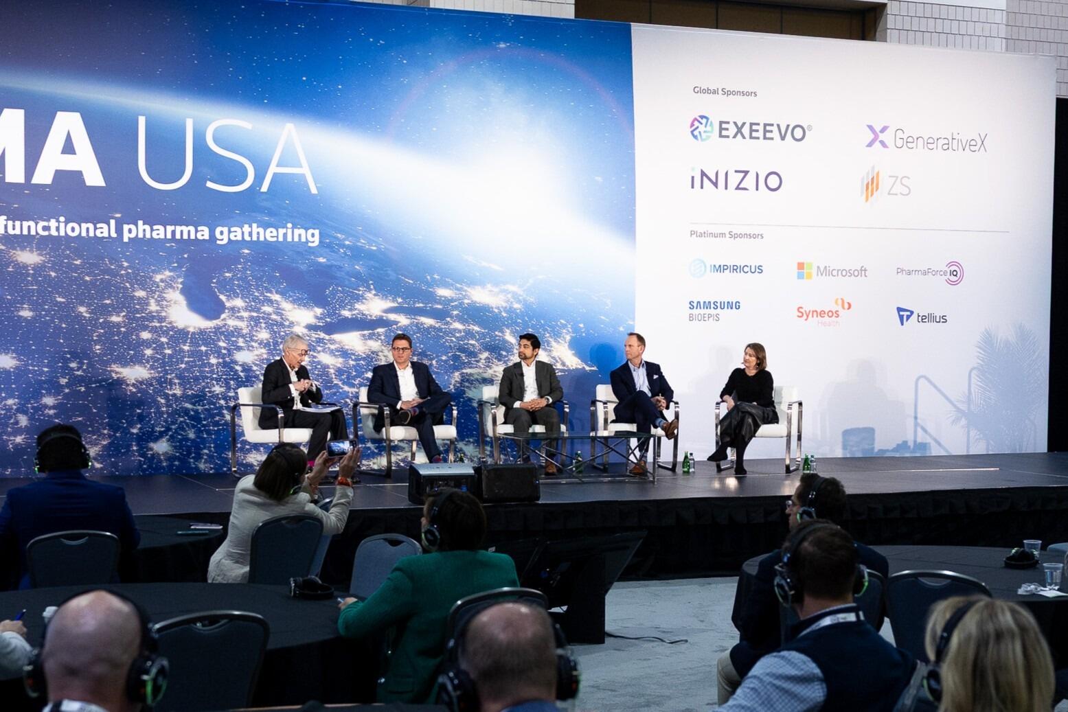 A moderator & 4 panellists onstage at Pharma USA